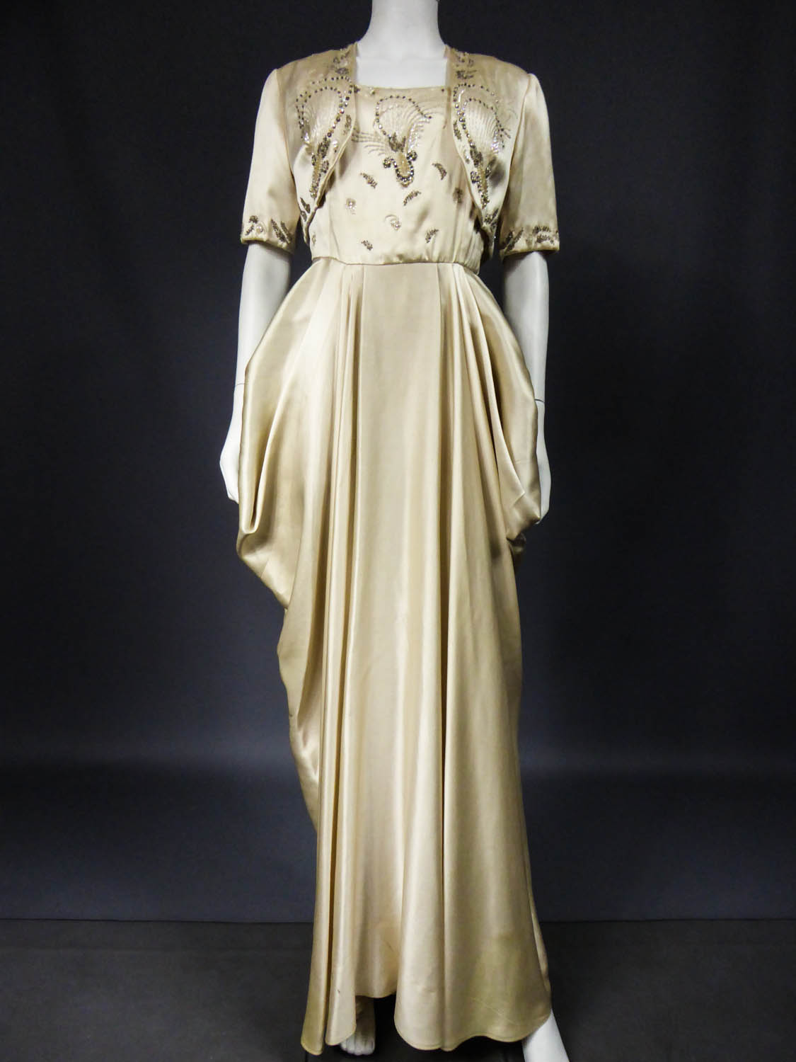 Paris, France. 13th Apr, 2022. A designer dress by Pierre Balmain is  exhibited during the permanent exhibition at the Palais Galliera museum.  The Palais Galliera also called the Fashion Museum of the